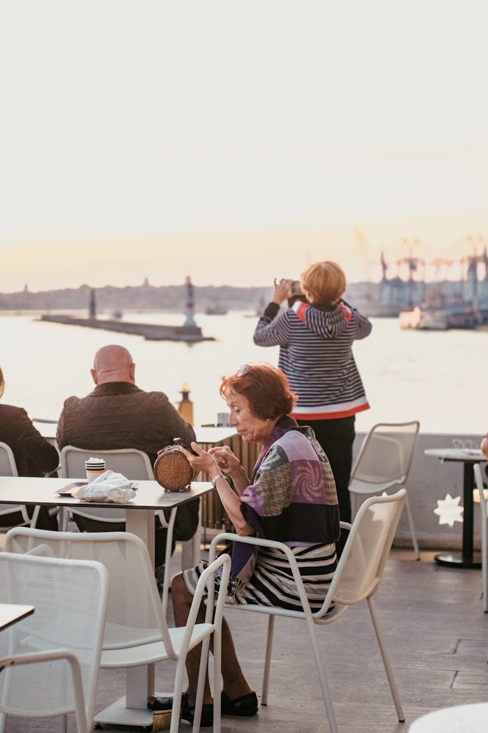 Enjoying a relaxing view over the sea at a seaside restaurant terrace during sunset.